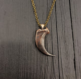 Large metal claw pendant on chain, polished detail | Moon Raven