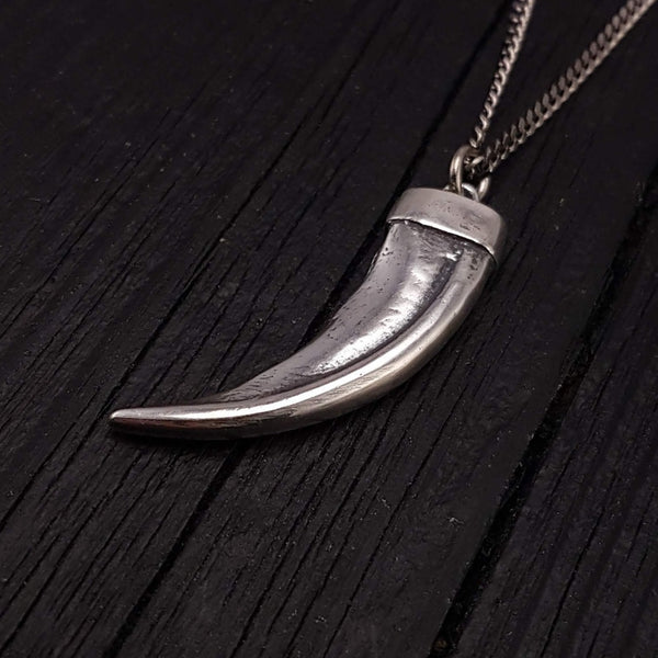 This 3D honey badger claw pendant is cast from a real claw in solid sterling silver. It measures 1-3/4&quot; around the curve with an eye catching bright polished finish.