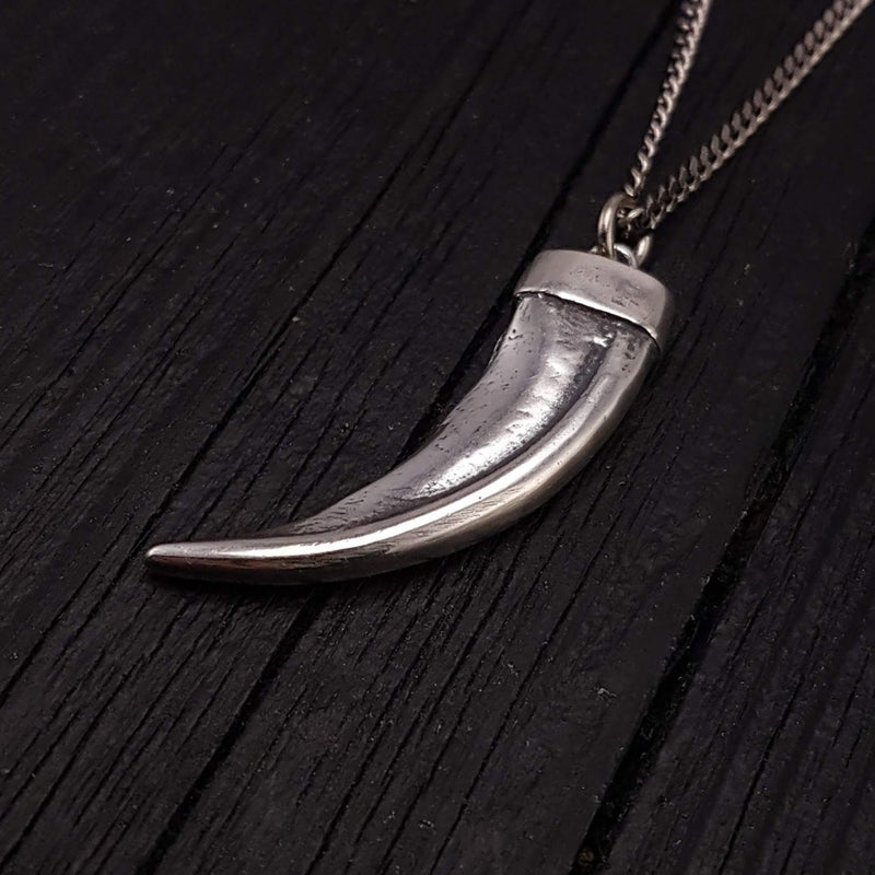 This 3D honey badger claw pendant is cast from a real claw in solid sterling silver. It measures 1-3/4&quot; around the curve with an eye catching bright polished finish.