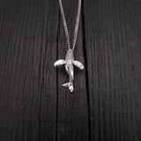 Pendant width: 7/8 Inches; height: 1 1/4 Inches. My breaching humpback whale is the perfect gift for anyone that appreciates these ocean mammals. This whale is completely three dimensional. It is cast in .925 Sterling Silver with a integrated bail.