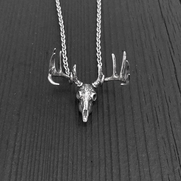 This pendant is the most realistic whitetail deer skull necklace you will find on Etsy. Made of sterling silver with an oxidized finish in the recesses. It measures 1-1/8&quot; wide and 1&quot; tall.