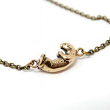 Floating Otter Necklace – Handcrafted Bronze Otter Pendant With Claw Clasp